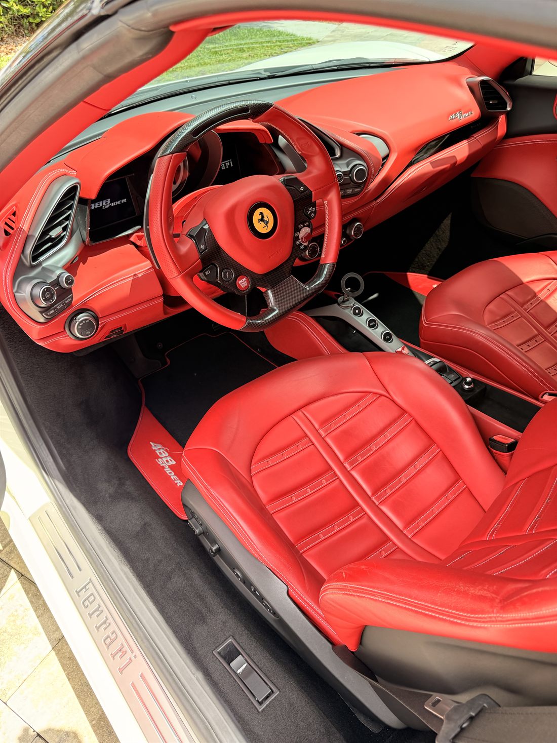 Detailed red leather interior of a Ferrari 488 Spider